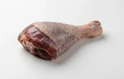 raw dark turkey meat with skin